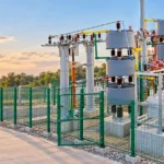 Illustrative CHYN-reference outdoor capacitor installation behind green fencing